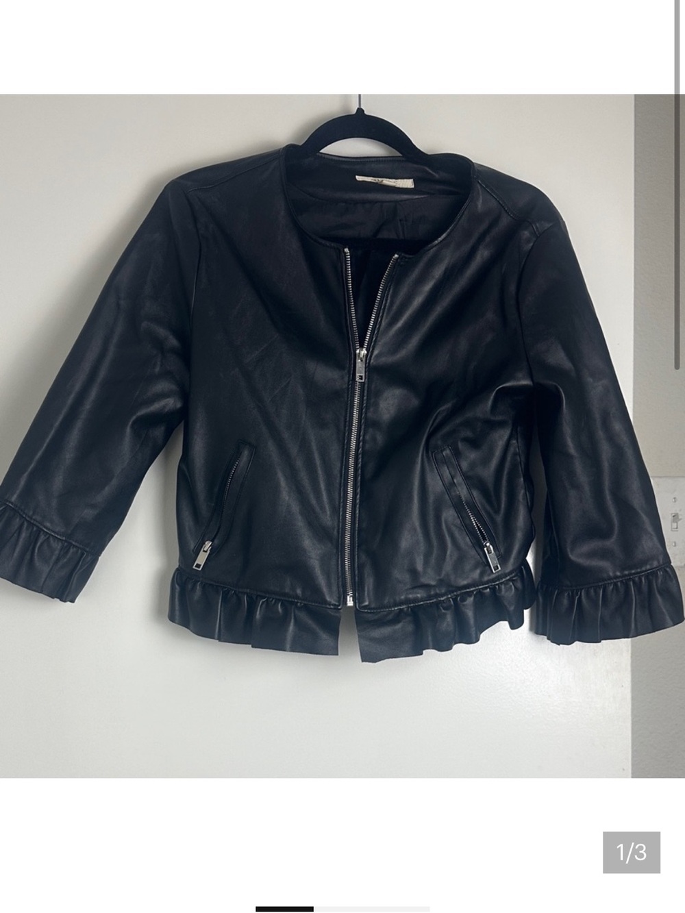 Francesca’s Black Cropped Faux Leather Ruffle Jacket
